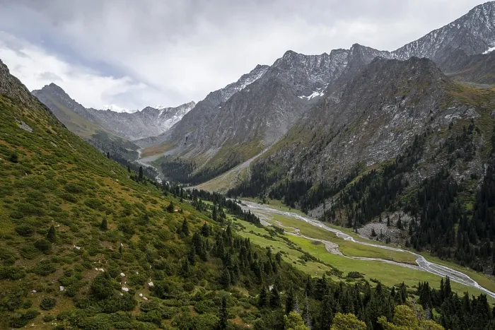 Framed Print : Green mountain valley with river and steep mountain peaks