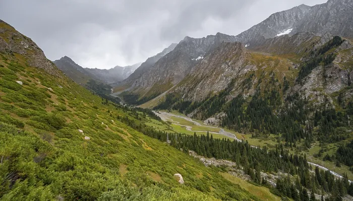 Framed Print : Green mountain valley with river and steep mountain peaks