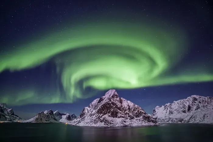 Framed Print : Green northern lights reflected in fjord