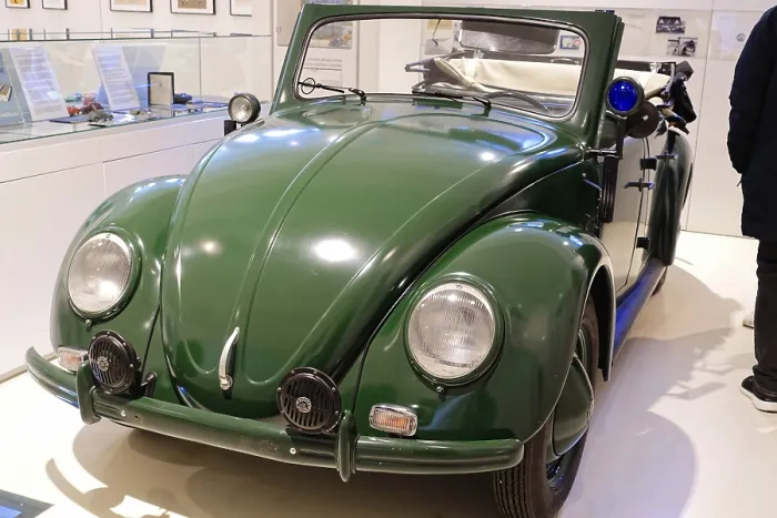 Framed Print : A green Volkswagen Beetle Cabriolet in shiny condition stands in the museum