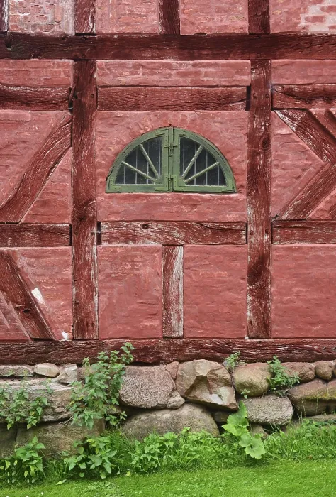Framed Print : Green window in a wall in a red half-timbered house in Den gamle by