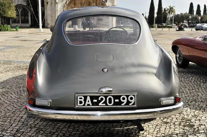 Framed Print : Grey vintage car parked from behind in a square