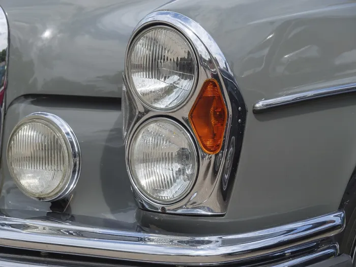 Framed Print : Grey vintage car with striking headlights and chrome details