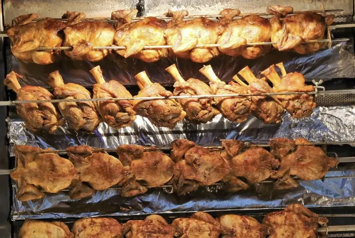 Framed Print : Grilled knuckle of pork and chicken on the spit