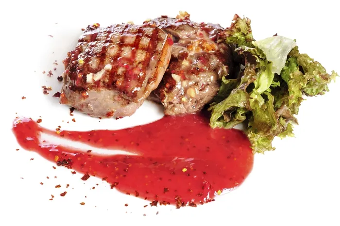 Framed Print : Grilled pork steaks with raspberry sauce and leaf of lettuce Framed Print : Grilled pork steaks with raspberry sauce and leaf of lettuce