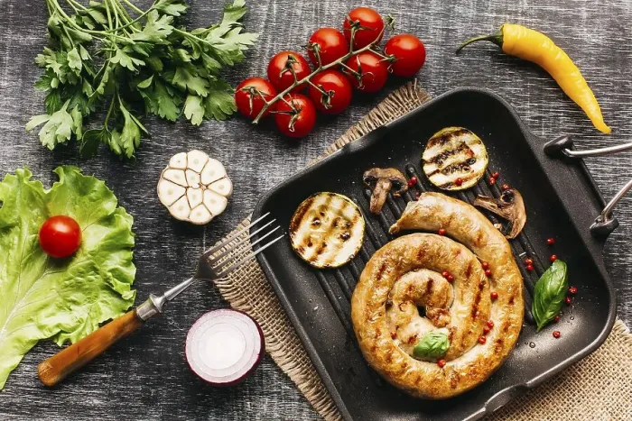 Framed Print : Grilled snail sausages pan with spices vegetable wooden grey backdrop