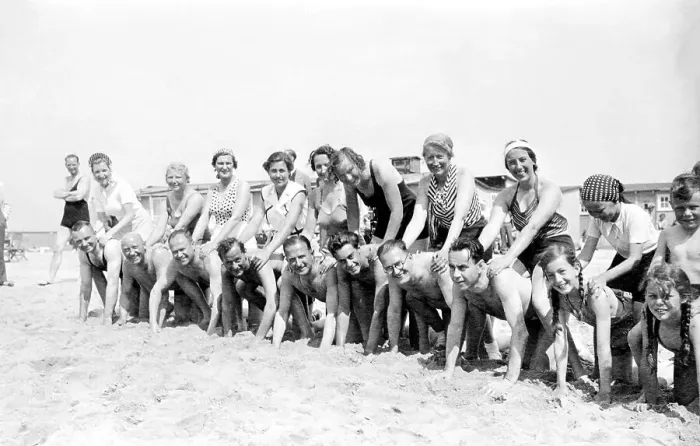 Framed Print : Group with bathers at the beach
