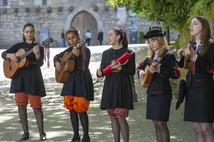 Framed Print : Group female university students musicians perform in street