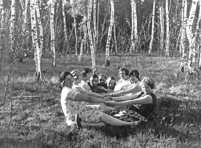 Framed Print : Group in the forest holding hands