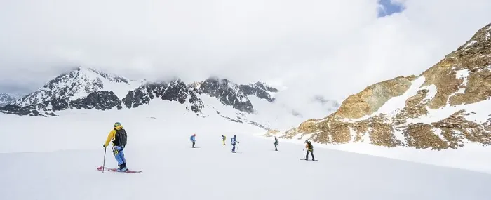 Framed Print : Group of ski tourers and splitboarders on the descent at Alpeiner Ferner