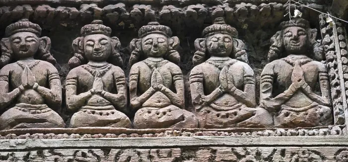 Framed Print : Group of statues of women are sitting and praying