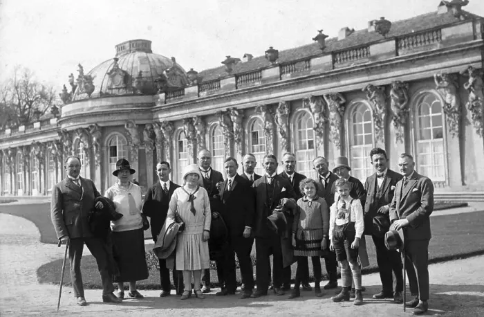 Framed Print : Group with tourists posing in front of Sanssouci Palace