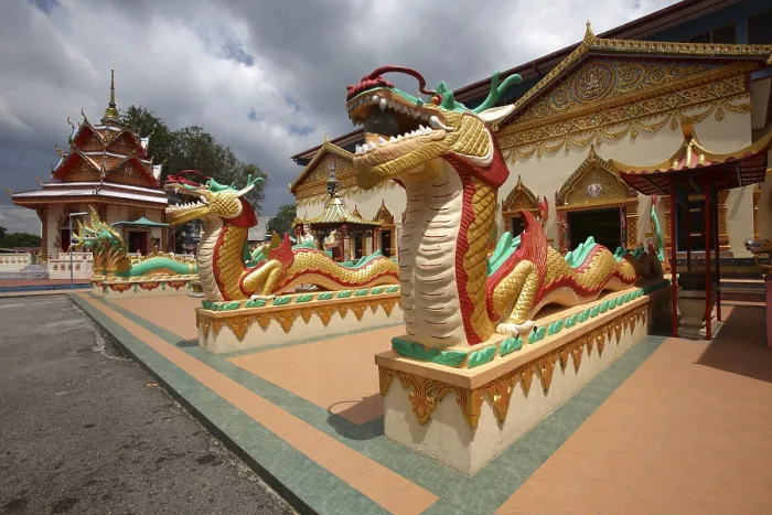 Framed Print : Guarding snakes at Wat Chayamangkalaram temple