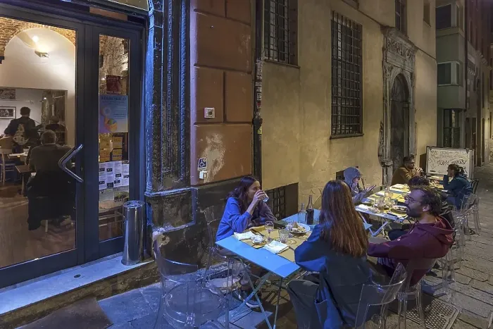 Framed Print : Guests sitting in the outdoor area of the Trattoria delle Grazie Framed Print : Guests sitting in the outdoor area of the Trattoria delle Grazie