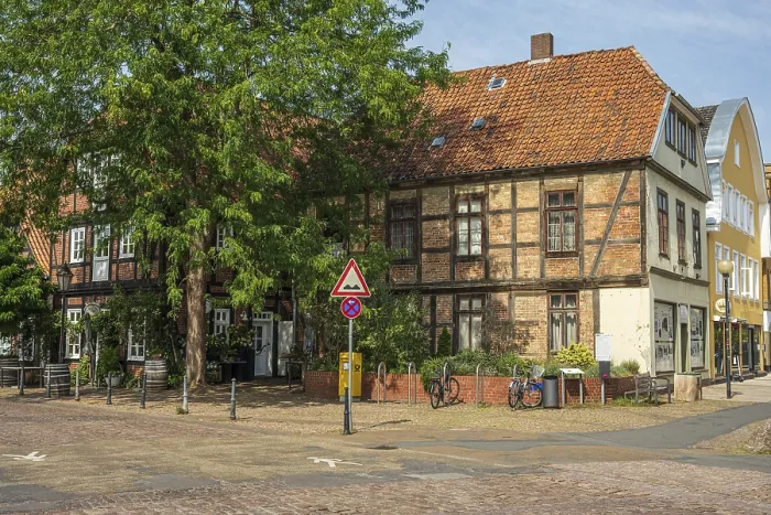 Framed Print : Half-timbered building with red bricks on a quiet street