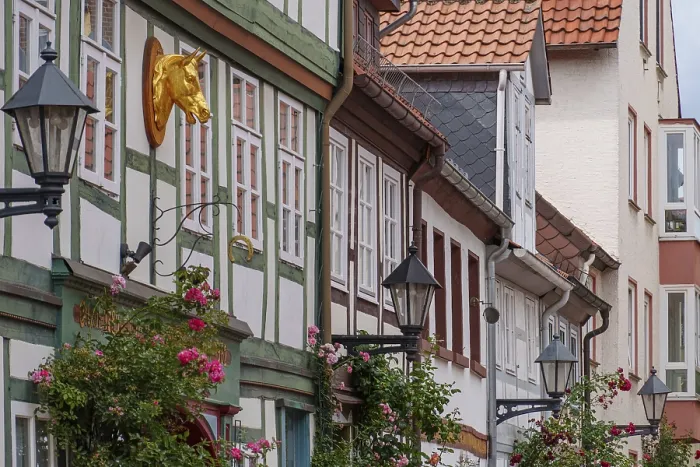 Framed Print : Half-timbered facades with stylish details and golden decoration in a historic setting