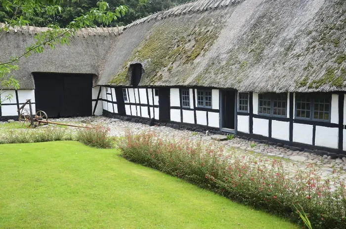 Framed Print : Half-timbered farmhouse and lawn in Den gamle by Framed Print : Half-timbered farmhouse and lawn in Den gamle by