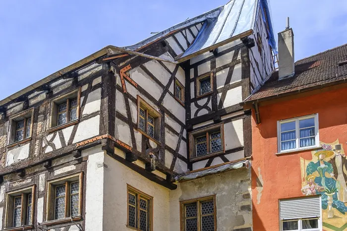 Framed Print : Half-timbered house from 1409 with bull's eye windows being renovated Framed Print : Half-timbered house from 1409 with bull's eye windows being renovated