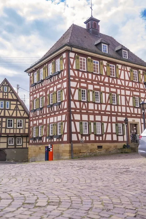 Framed Print : Another half-timbered house on a cobbled street under a blue sky Framed Print : Another half-timbered house on a cobbled street under a blue sky