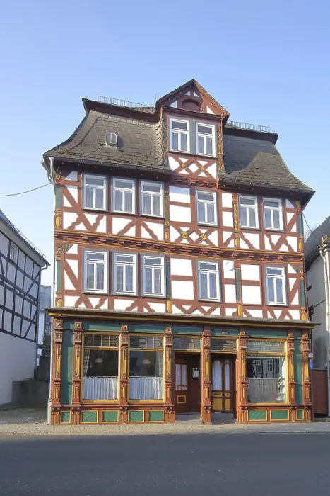 Framed Print : Half-timbered house in the main street Framed Print : Half-timbered house in the main street
