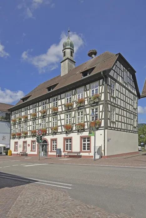 Framed Print : Half-timbered house and town hall with spire