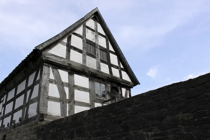 Framed Print : Half-timbered house with wall