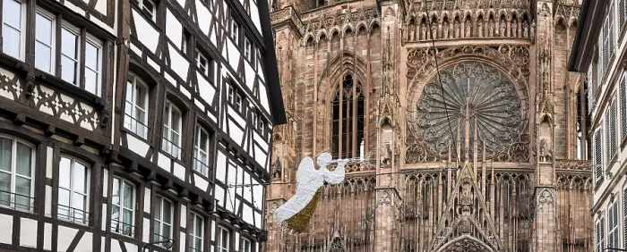 Framed Print : Half-timbered house and white Christmas stylised angel with trumpet