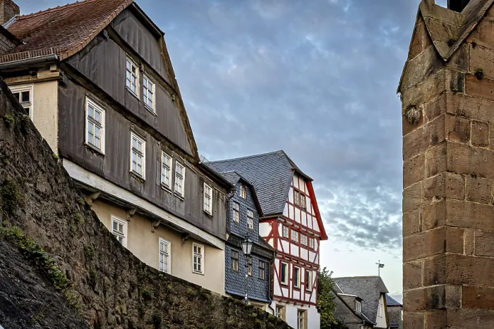 Framed Print : Half-timbered houses and city walls in a cozy evening mood