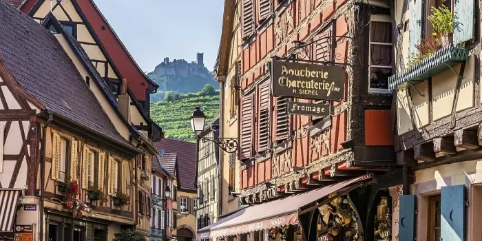 Framed Print : Half-timbered houses in the old town in front of the rock castle of Saint Ulrich