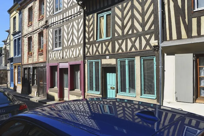 Framed Print : Half-timbered houses are reflected on the roof of a car Framed Print : Half-timbered houses are reflected on the roof of a car