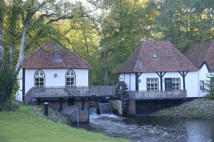 Framed Print : Two half-timbered houses on a river with a mill surrounded by trees and nature