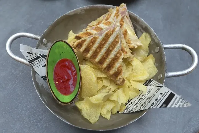 Framed Print : Ham and cheese toast with chips and ketchup served in a metal bowl Framed Print : Ham and cheese toast with chips and ketchup served in a metal bowl