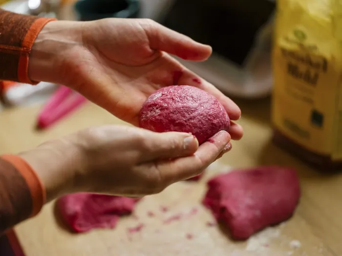 Framed Print : Hand moulding the dough for beetroot burger buns
