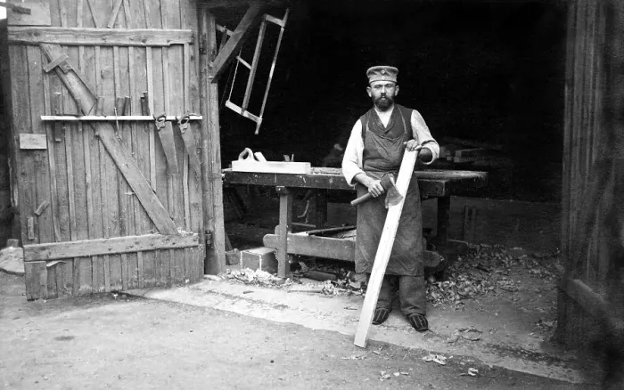 Framed Print : Handicraft, carpenter in front of the workshop Framed Print : Handicraft, carpenter in front of the workshop