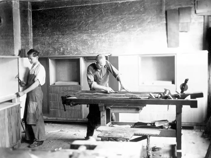 Framed Print : Handicraft, two carpenters working in a workshop