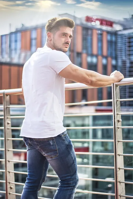 Framed Print : Handsome fit man in white t-shirt outdoor in city setting Framed Print : Handsome fit man in white t-shirt outdoor in city setting