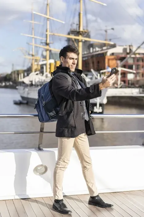 Framed Print : Handsome tourist taking selfies in Puerto Madero