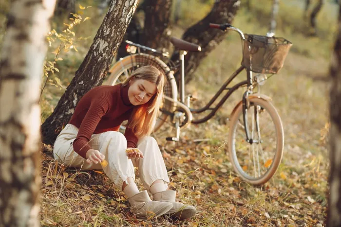 Framed Print : Happy active young woman riding vintage bicycle in autumn park at sunset