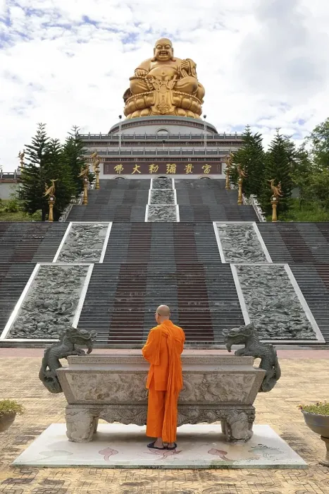 Framed Print : Happy Buddha, monk at an altar Framed Print : Happy Buddha, monk at an altar