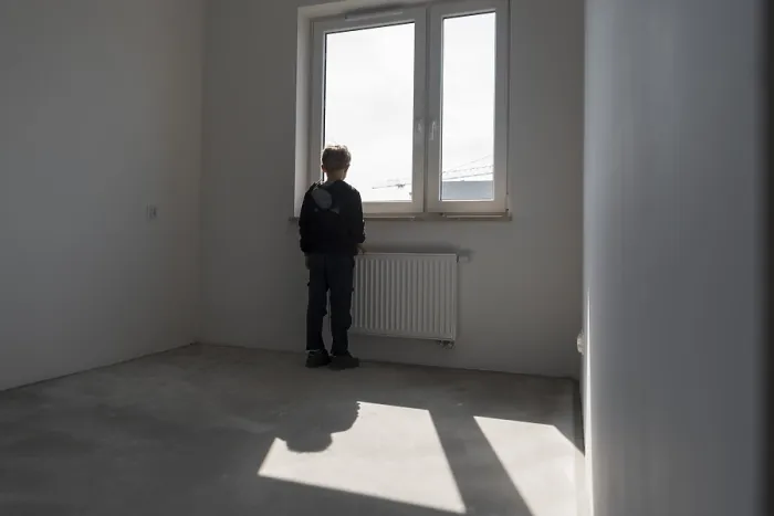 Framed Print : Happy young boy in his new empty room in the new flat in Wroclaw Framed Print : Happy young boy in his new empty room in the new flat in Wroclaw
