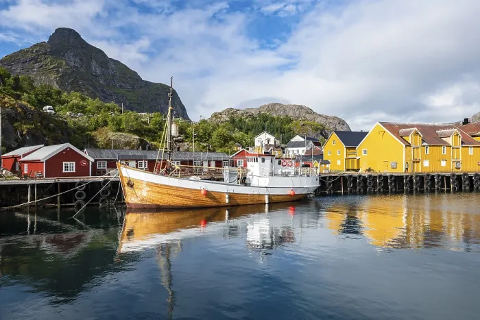 Framed Print : Harbour with fishing boat, Rorbu cabins