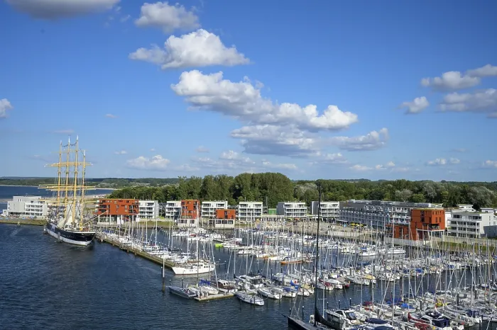 Framed Print : Harbour view with the legendary four-masted PASSAT barque and many boats in front of modern buildings under blue skies