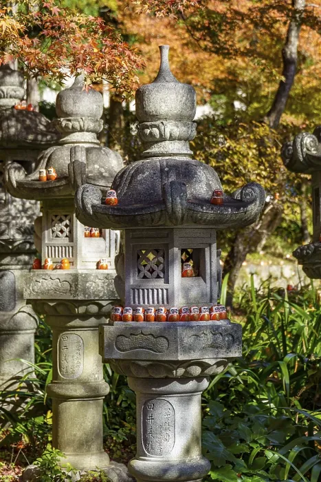 Framed Print : Harmonious atmosphere in Zen garden with stone lanterns and Daruma in autumn colors