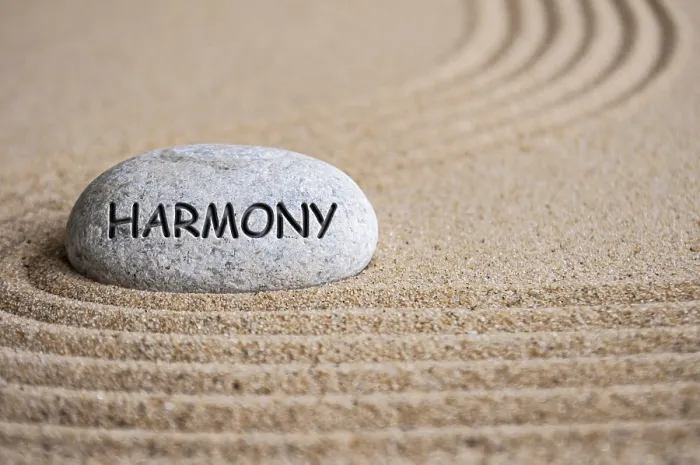 Framed Print : Harmony text engraved on Zen stone on sand Framed Print : Harmony text engraved on Zen stone on sand