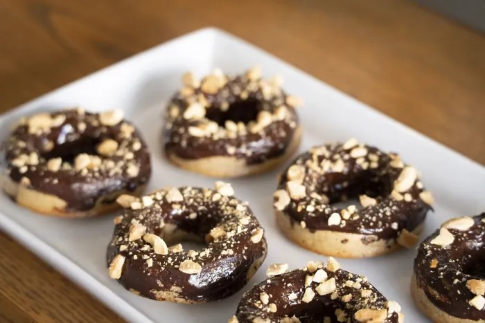 Framed Print : Healthy gluten-free donuts covered in chocolate and almonds Framed Print : Healthy gluten-free donuts covered in chocolate and almonds