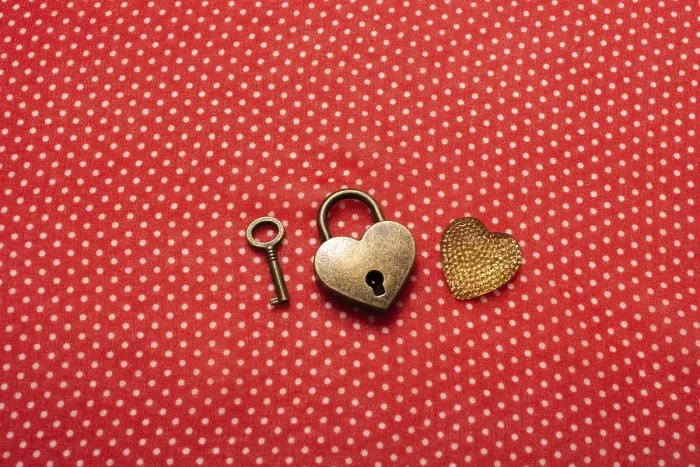 Framed Print : Heart shaped lock and key on a red background
