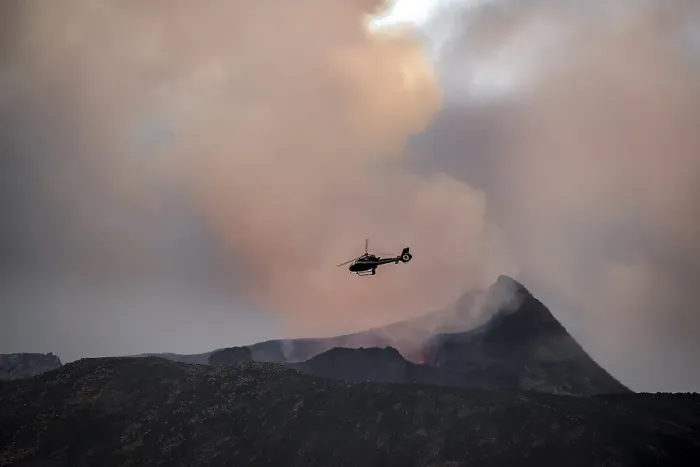 Framed Print : Helicopter flying over smoking active volcanic crater Framed Print : Helicopter flying over smoking active volcanic crater