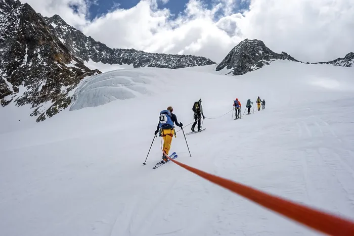 Framed Print : High altitude tour, ski tourers walking on a rope over Alpeiner Ferner glacier