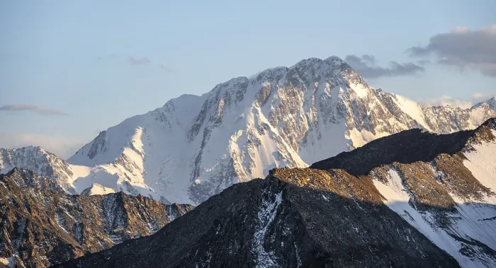 Framed Print : High mountain peaks with glaciers at sunset