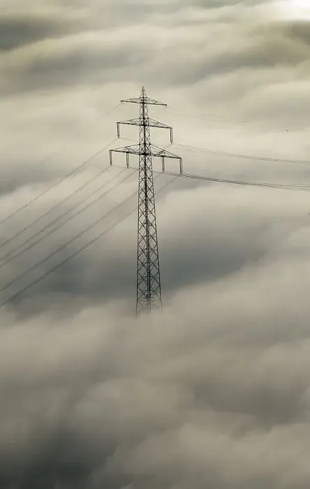 Framed Print : High voltage pylon in fog, aerial view